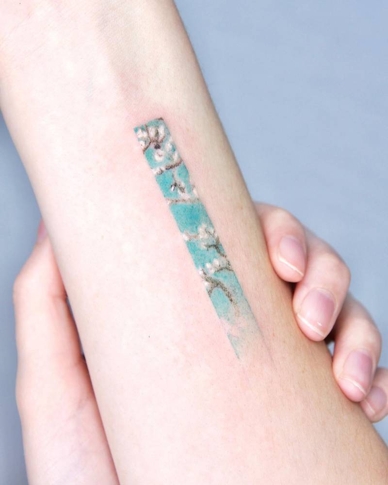 Van Gogh's Almond Blossom tattoo hand poked on the inner forearm.