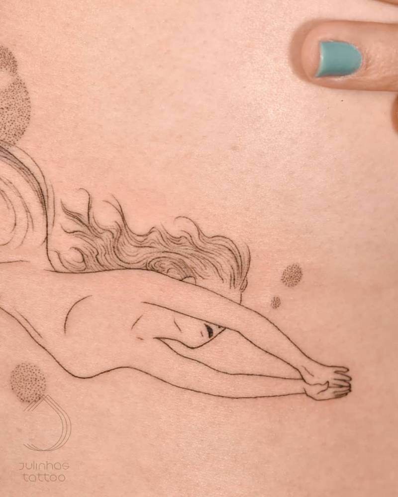 Fine line mermaid tattoo located on the side boob.
