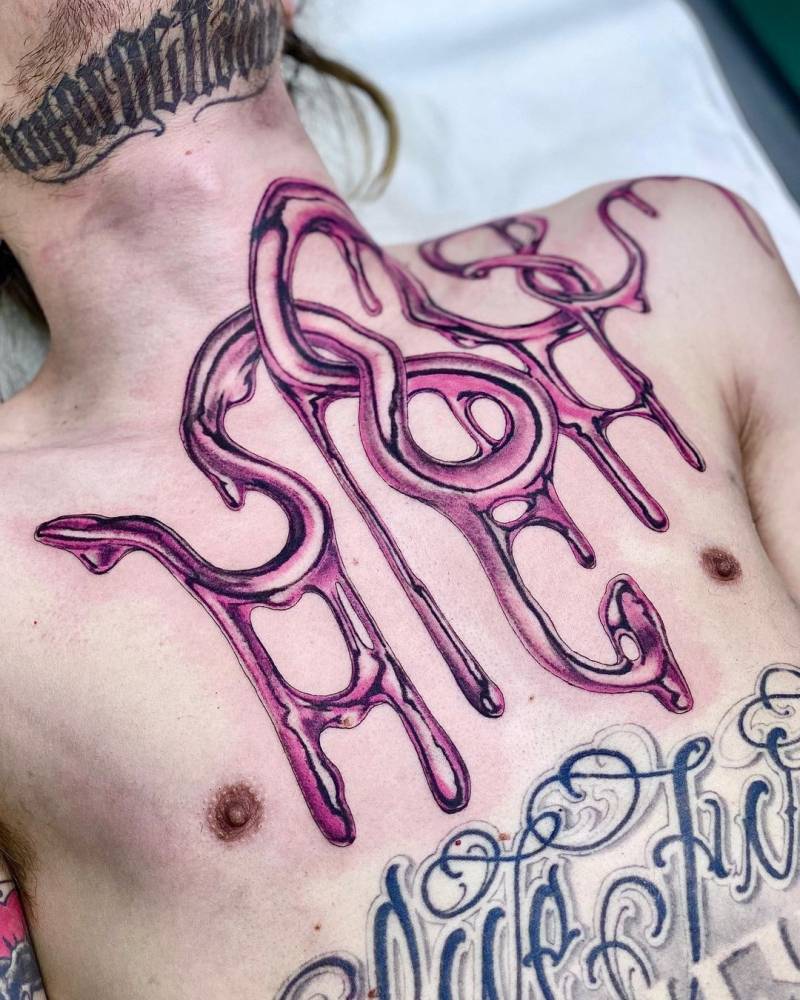 Metallic effect "HIGH" lettering tattoo on the chest.