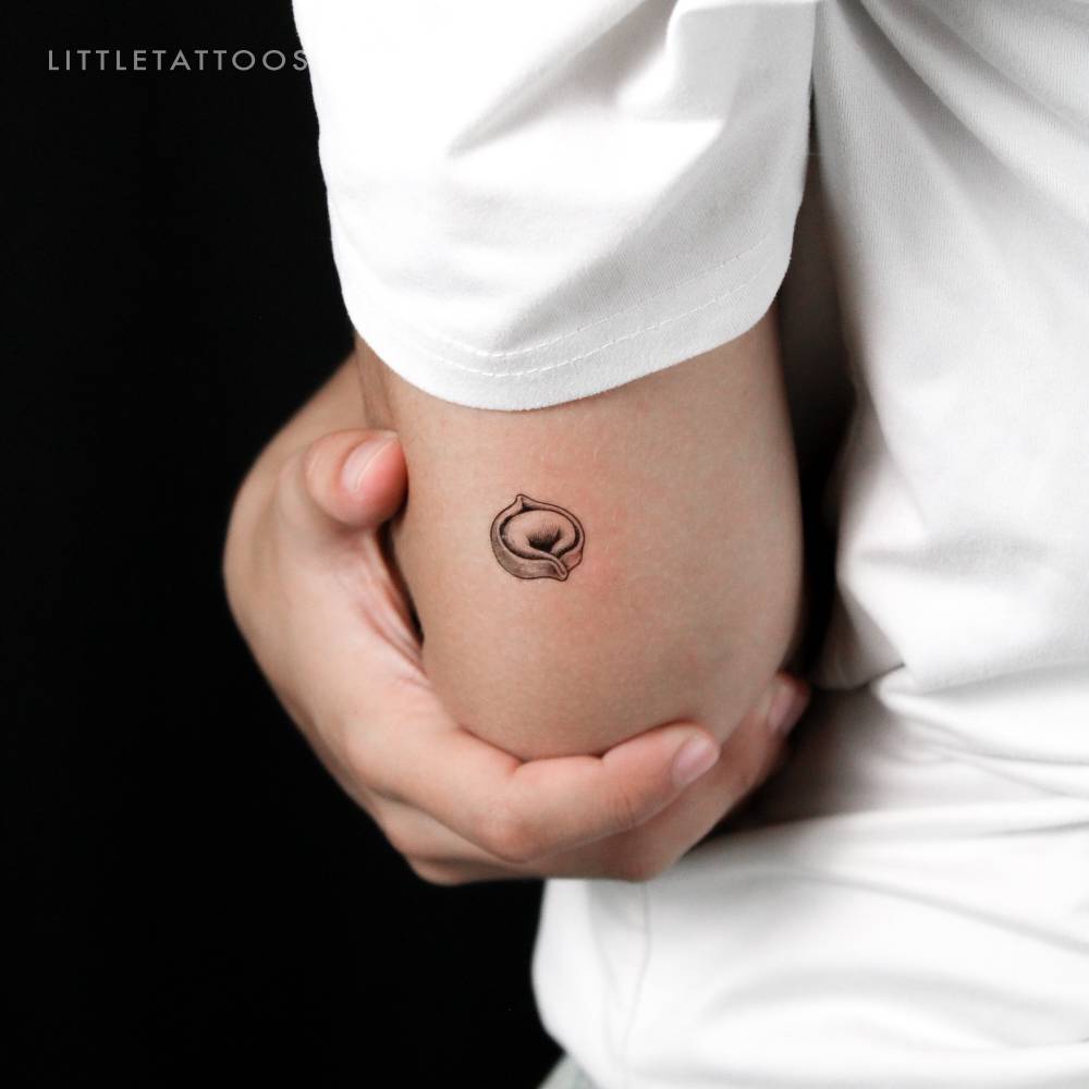 Tortellini pasta temporary tattoo located on the tricep.