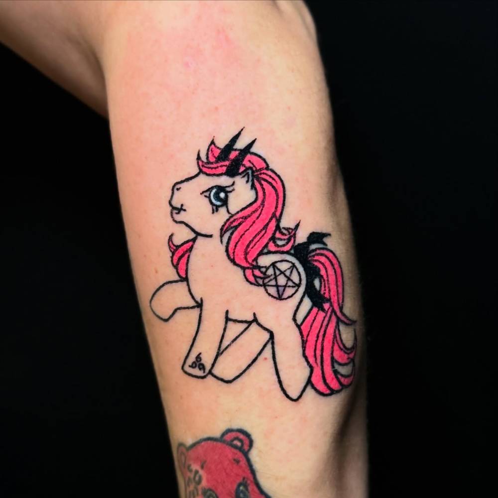 My Little Pony tattoo in cartoon style hand poked on the forearm.