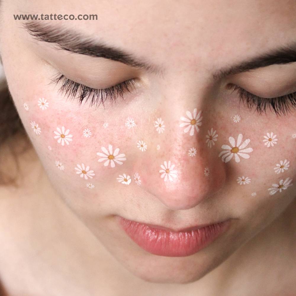 Daisy freckles temporary tattoo placed on the face.