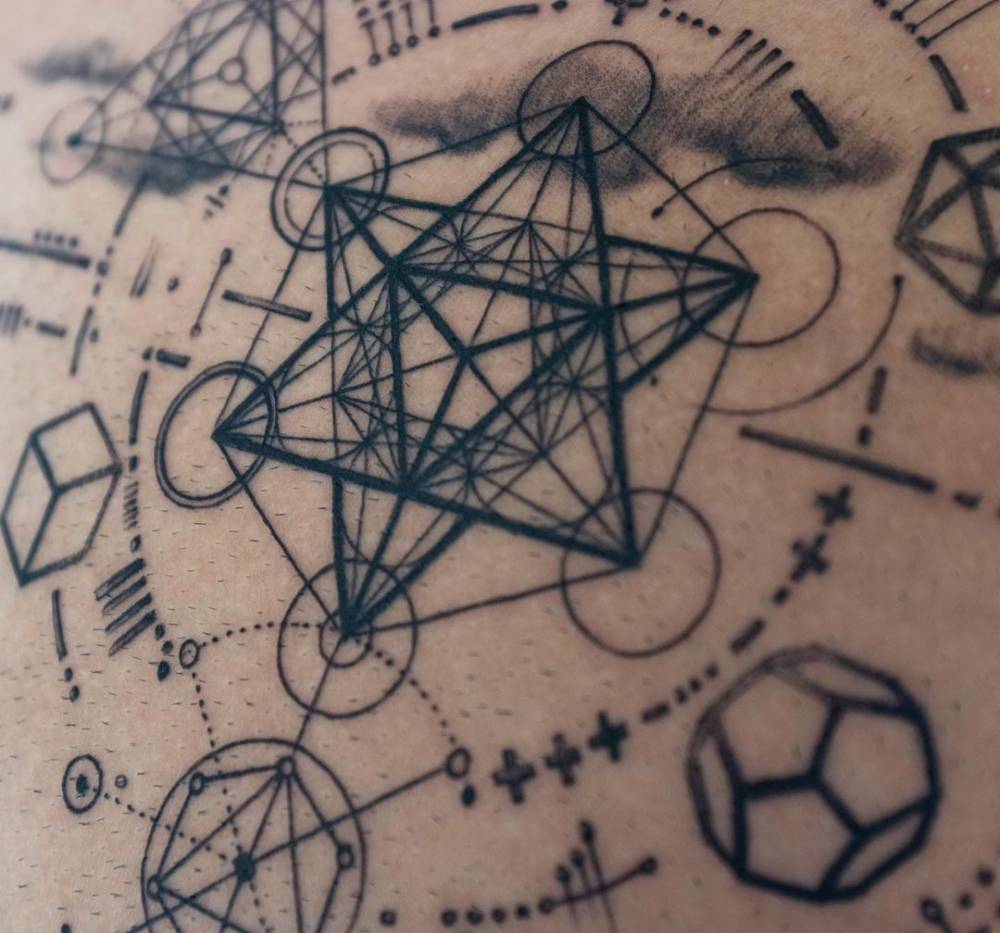 Metatron's Cube tattoo on the chest.