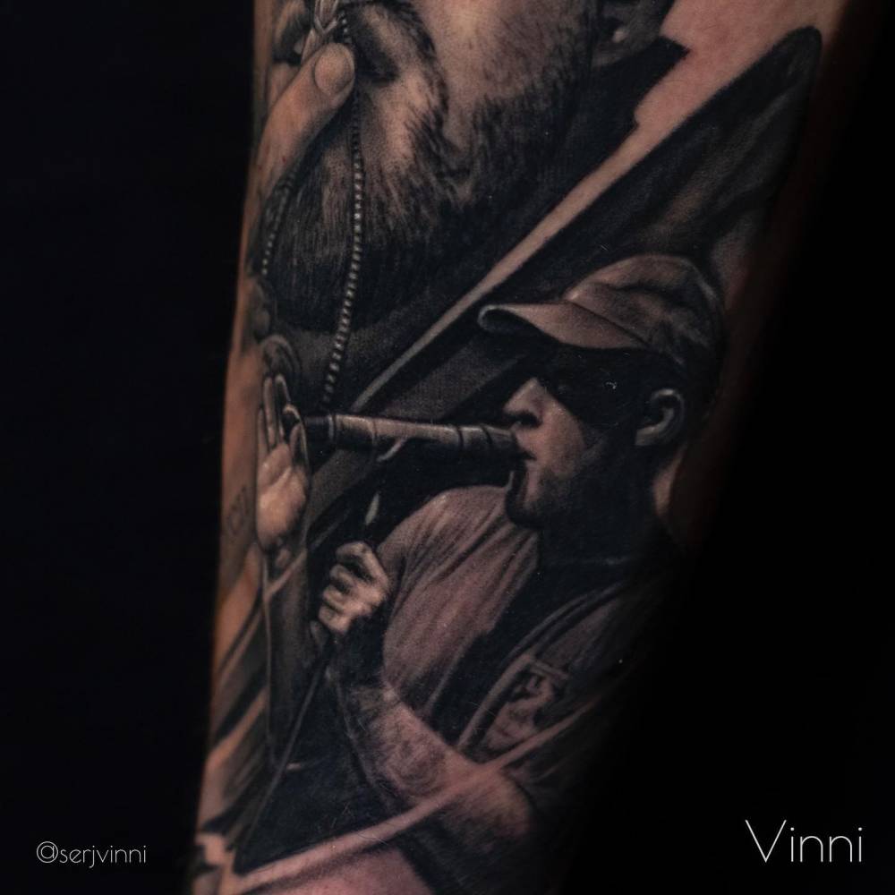 Healed Mac Miller tattoo located on the forearm.