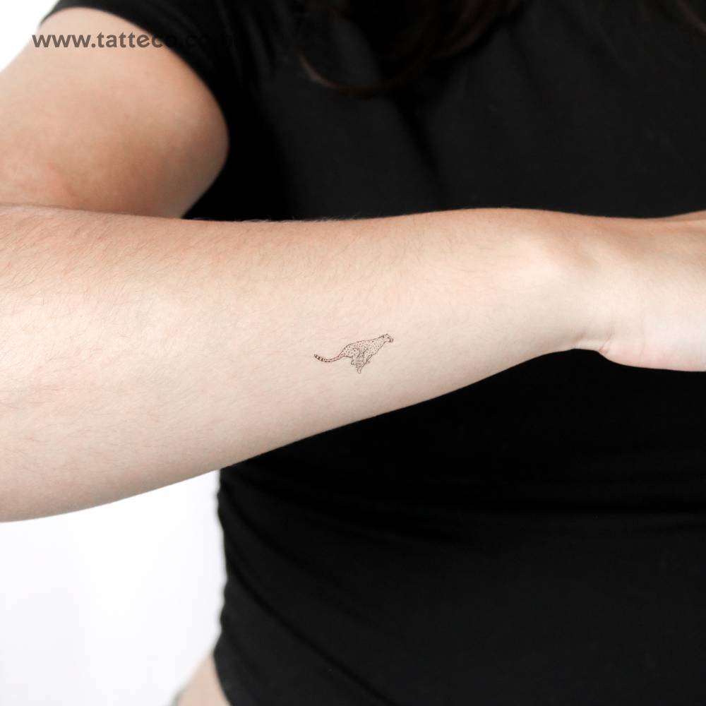 Small running cheetah temporary tattoo located on the wrist.