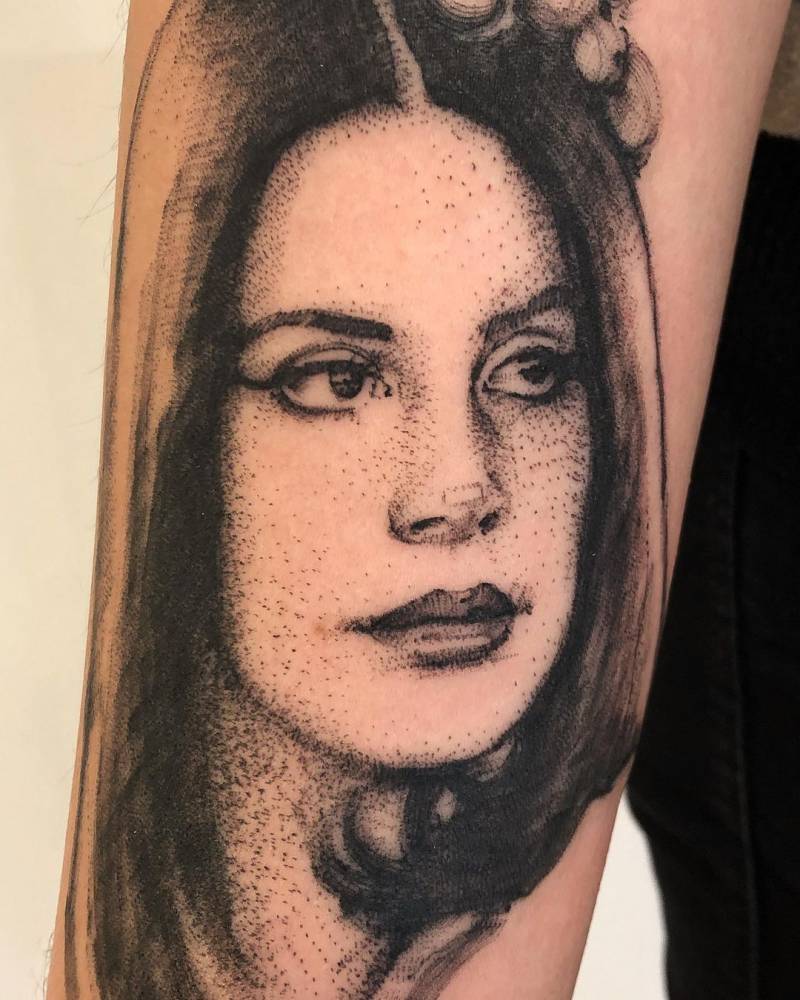Sketch work Lana Del Rey portrait tattoo on the inner forearm