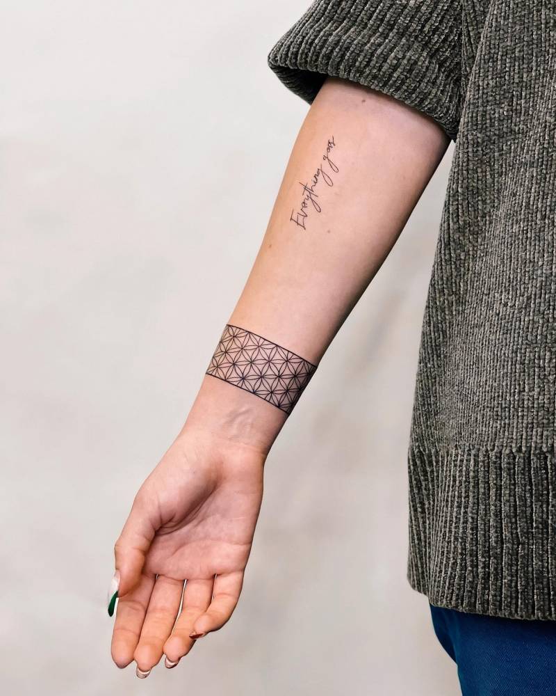 Flower of life pattern wristband tattoo.