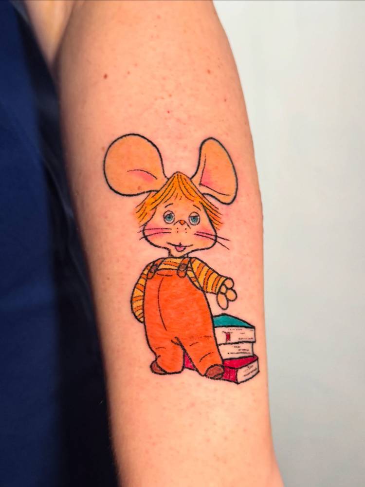 Topo Gigio tattoo in cartoon style hand poked on the tricep.