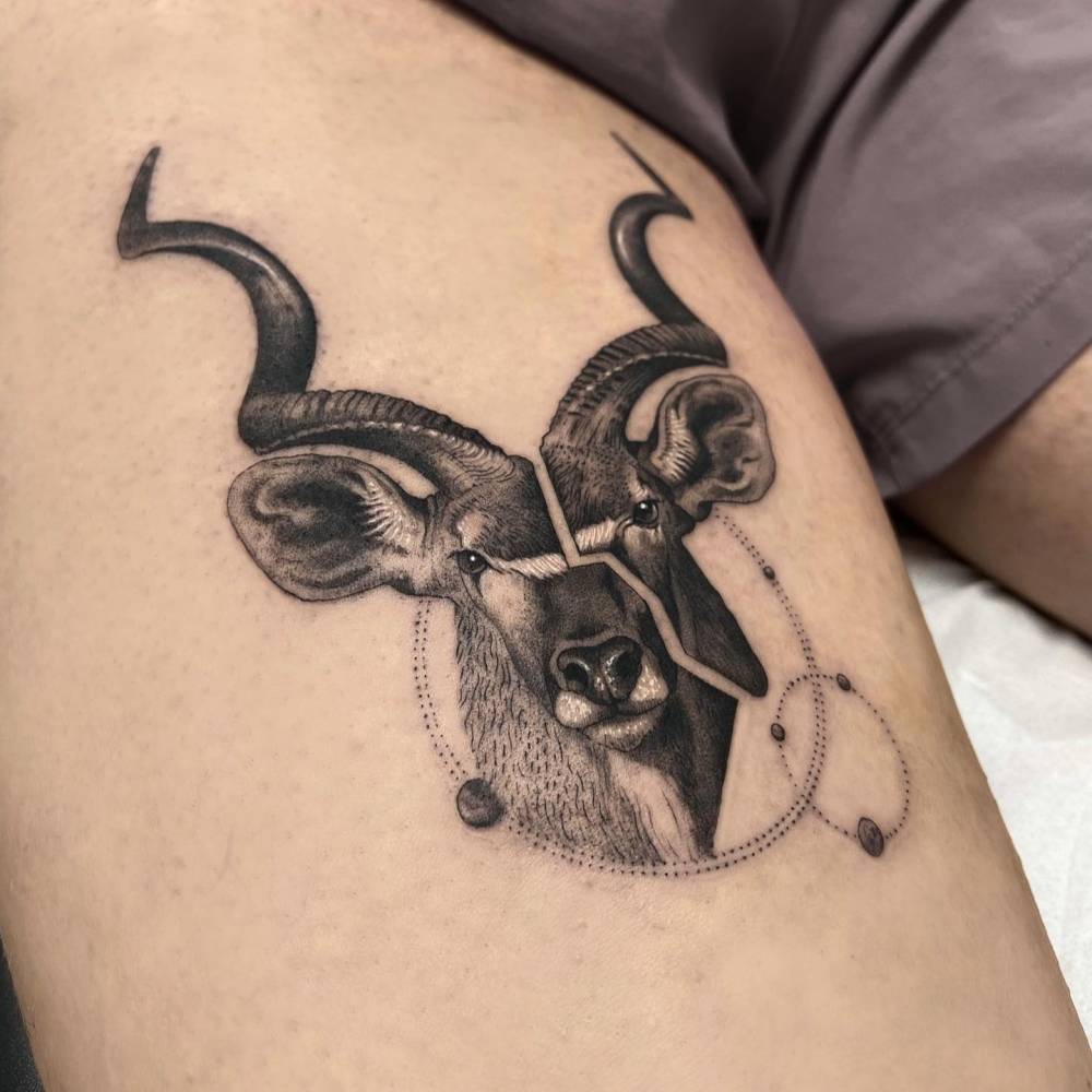 Micro-realistic style 'City of God' tattoo located on the inner arm.