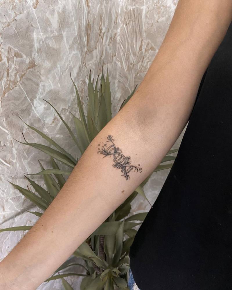 Dna tattoo on the inner forearm.
