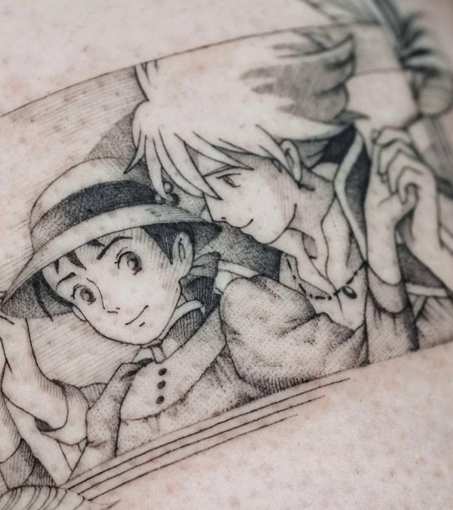 Howl and Sophie tattoo located on the thigh.