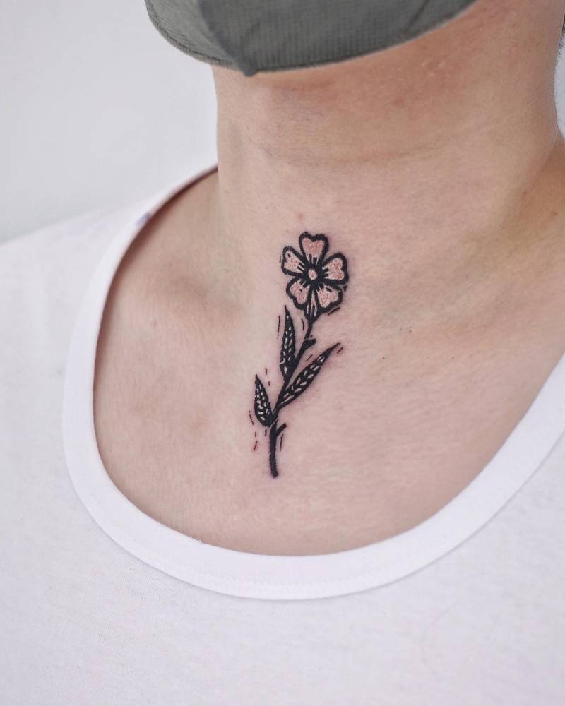 Pop art style flower tattoo placed on the throat.
