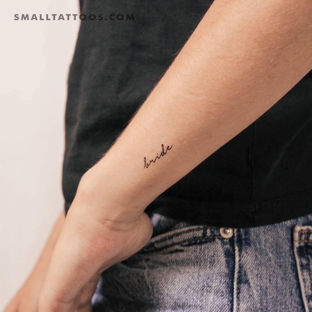 Word "bride" temporary lettering tattoo in handwritten font.