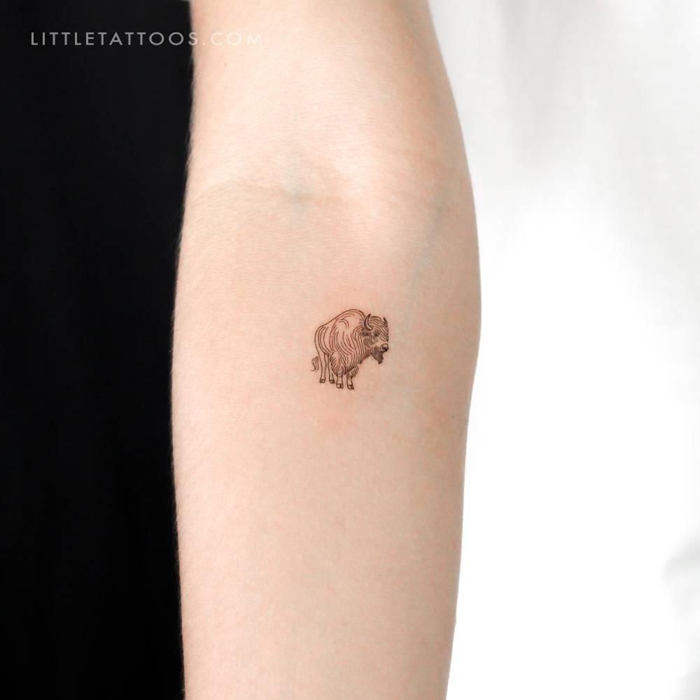 Fine line style bison temporary tattoo located on the inner forearm.