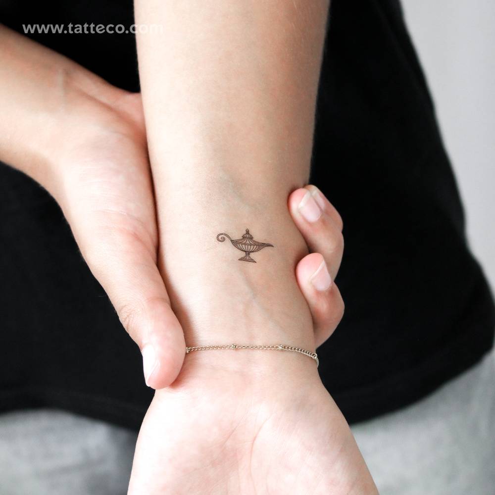 Magical oil lamp temporary tattoo located on the wrist.