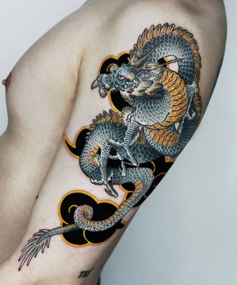 Japanese style dragon tattoo located on the upper arm.