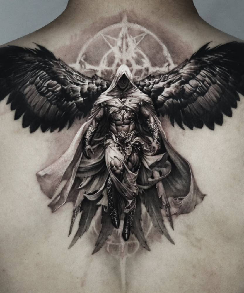 Black an grey angel tattoo placed on the upper back.