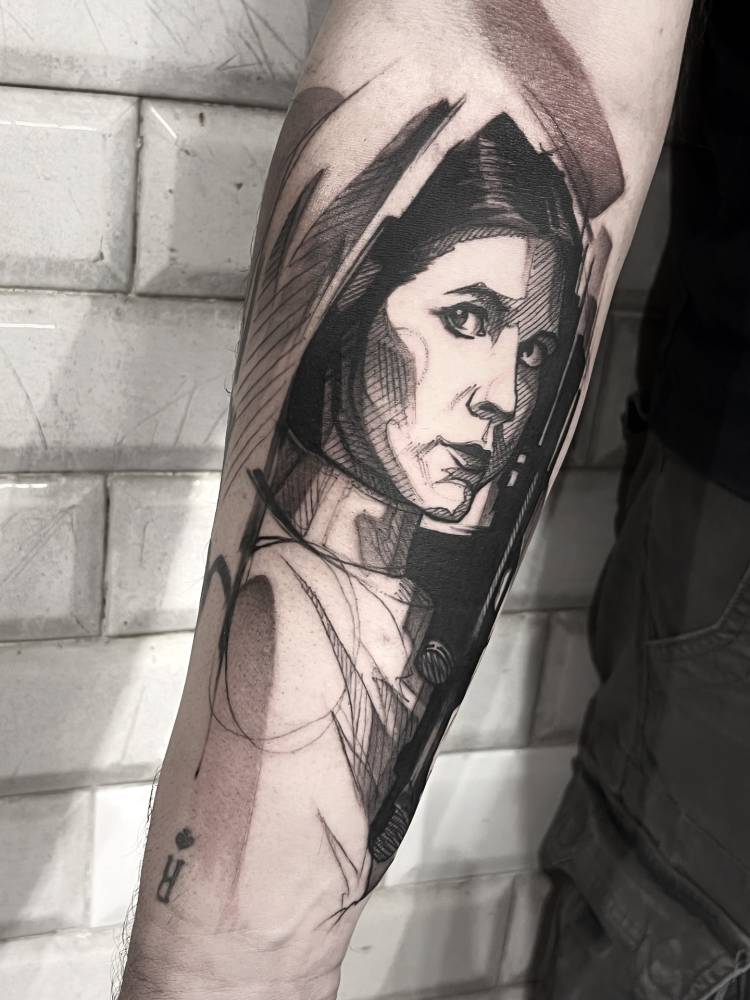 Sketch work style Princess Leia portrait tattoo located on the inner forearm.