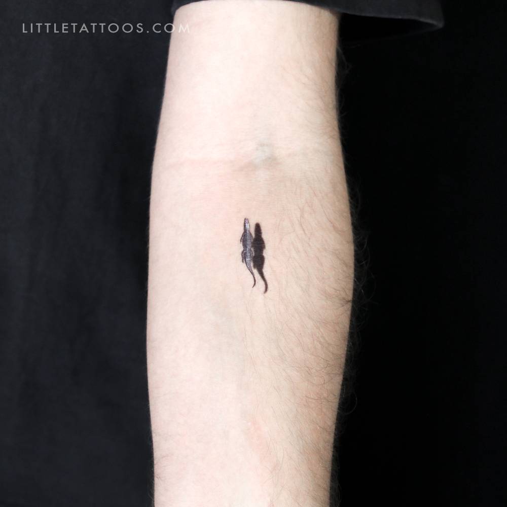 Alligator and shadow temporary tattoo located on the inner forearm.