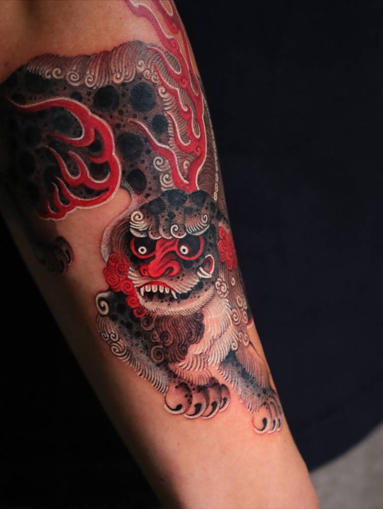 Irezumi style foo dog tattoo located on the forearm.