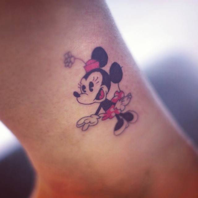Cartoon style Minnie Mouse tattoo placed on the ankle.