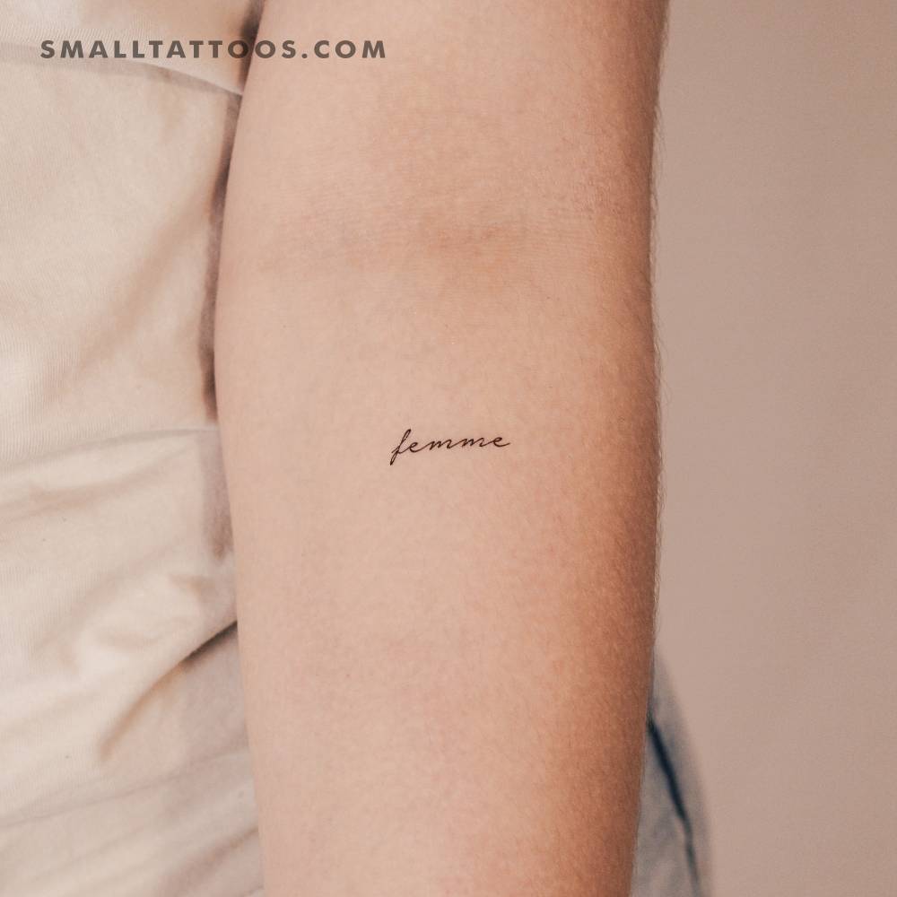 Handwritten font word "femme" temporary tattoo located on the inner forearm.