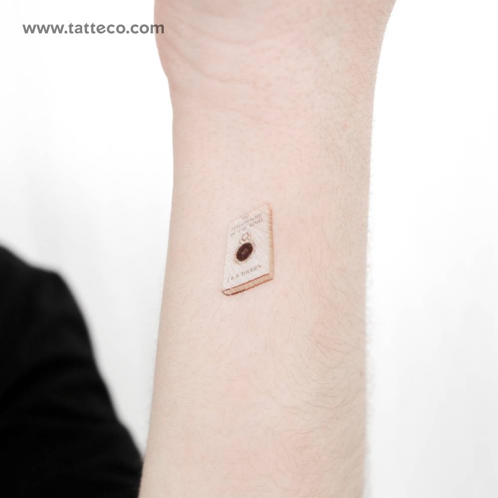 'The Fellowship Of The Ring' book temporary tattoo located on the wrist.