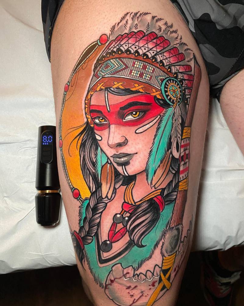 Native american woman tattooed on the thigh, neotraditional style.