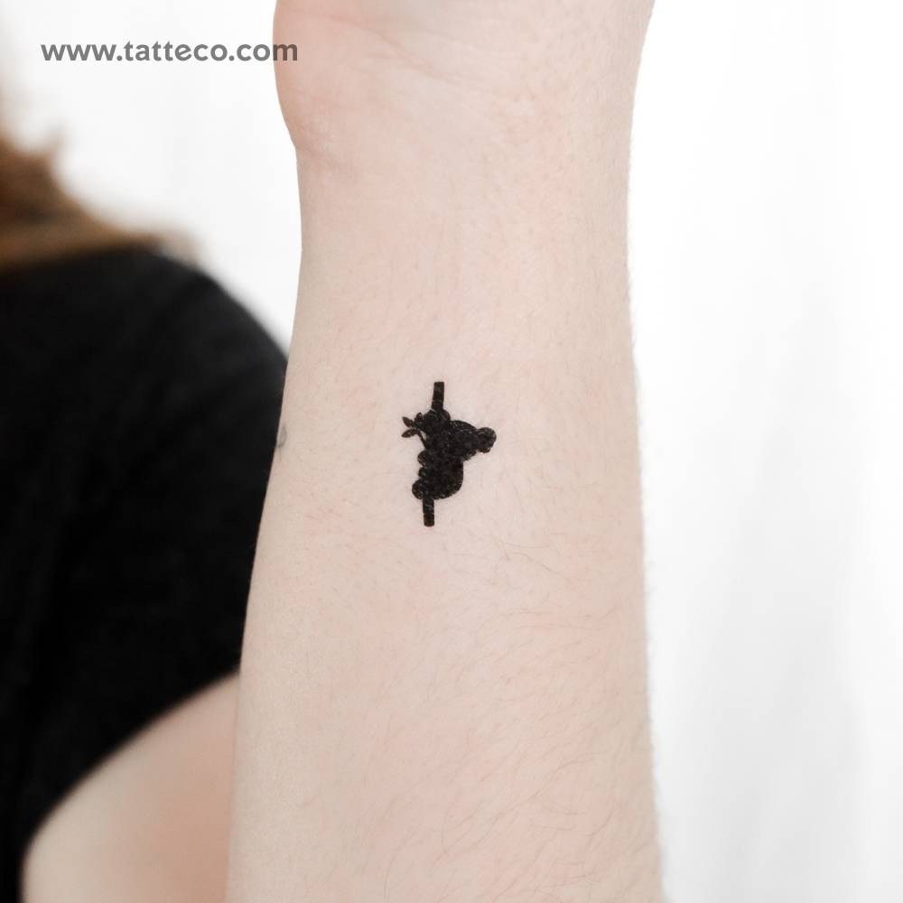Minimalistic little koala temporary tattoo located on the wrist.