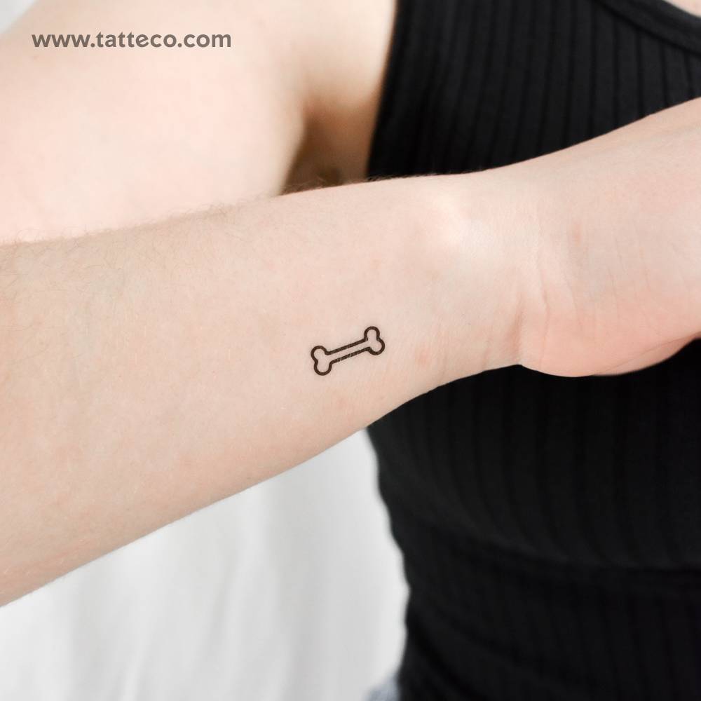 Minimalistic style little bone temporary tattoo located on the wrist.
