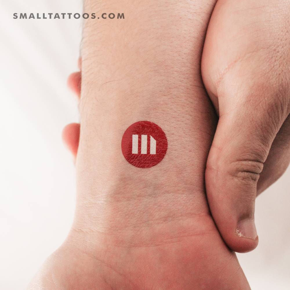 MicroStrategy logo temporary tattoo located on the wrist.
