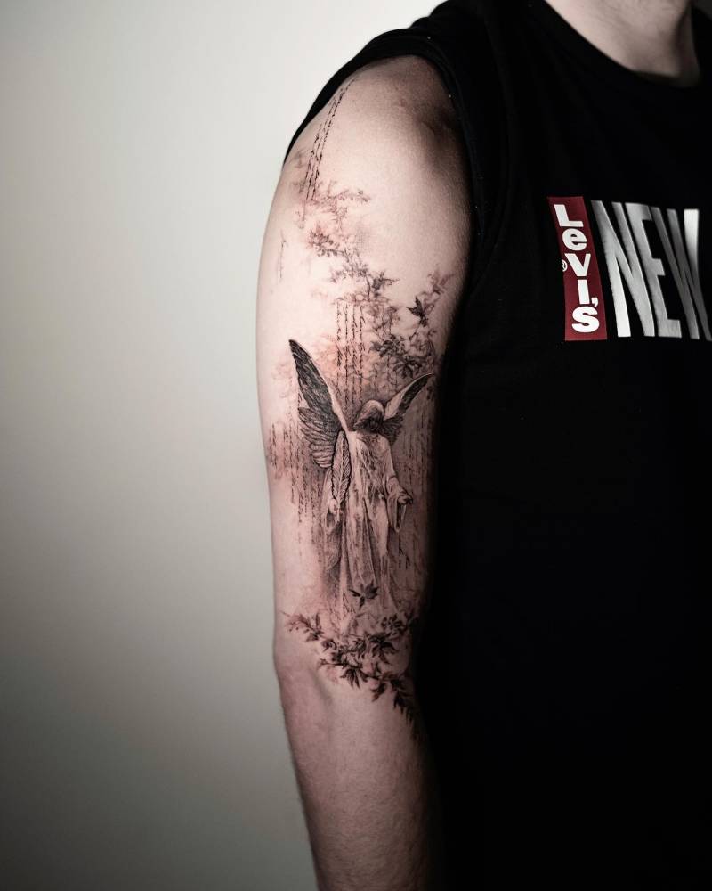 Micro-realistic angel tattoo done on the upper arm.