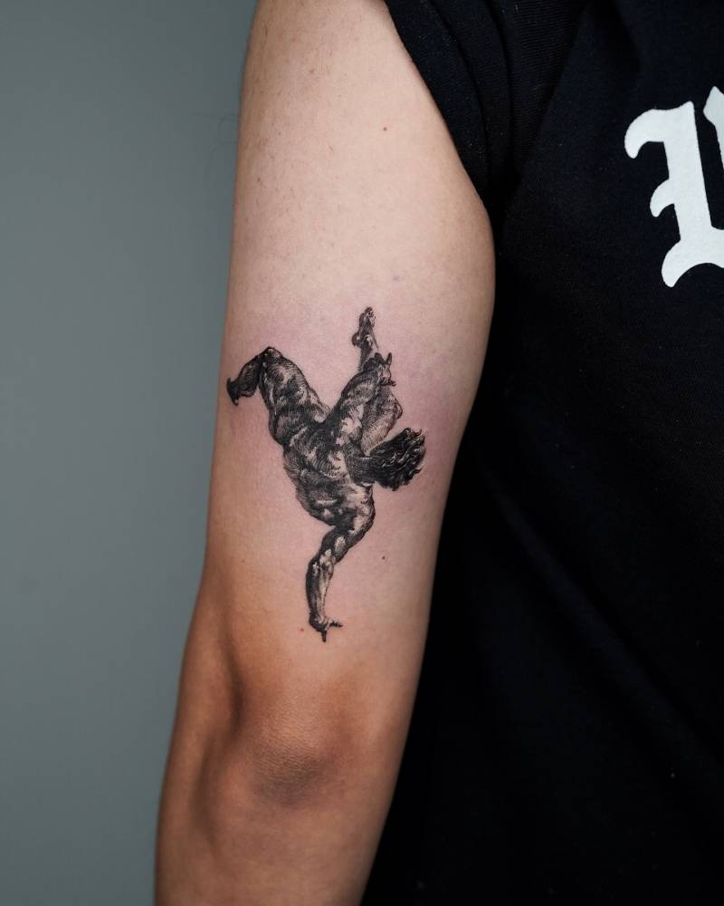 Phaeton tattoo located on the tricep, blackwork style.