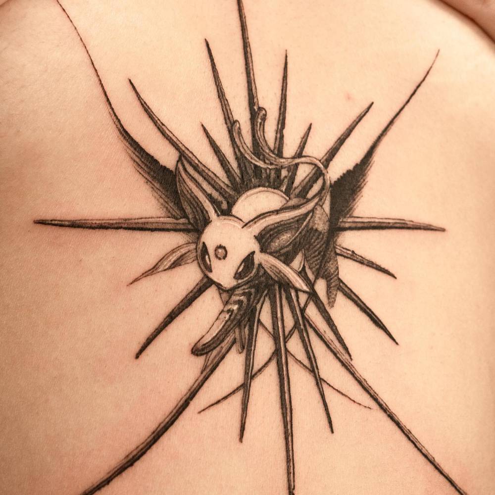 Espeon in blackwork style tattooed on the sternum.