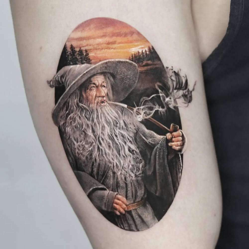 Gandalf tattoo in micro-realistic style located on the upper arm.