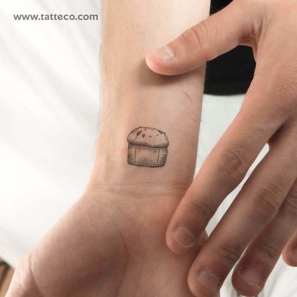 Panettone temporary tattoo in engraving style located on the wrist.