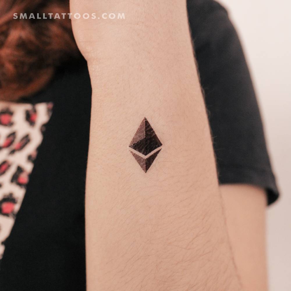 Ethereum logo temporary tattoo located on the wrist.