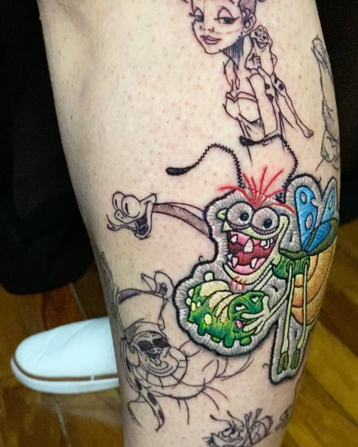 'The Princess and the Frog' patch tattoo located on the shin.