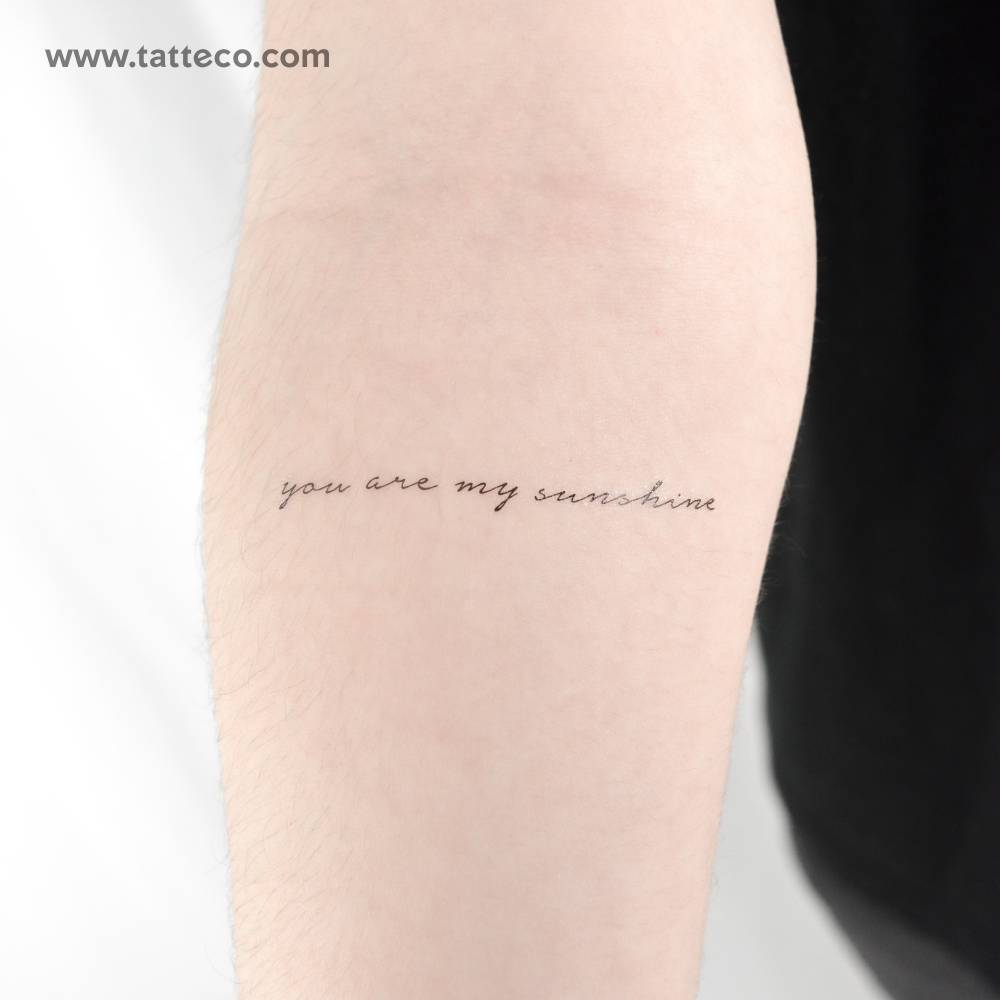 "You are my sunshine" temporary tattoo located on the inner forearm.