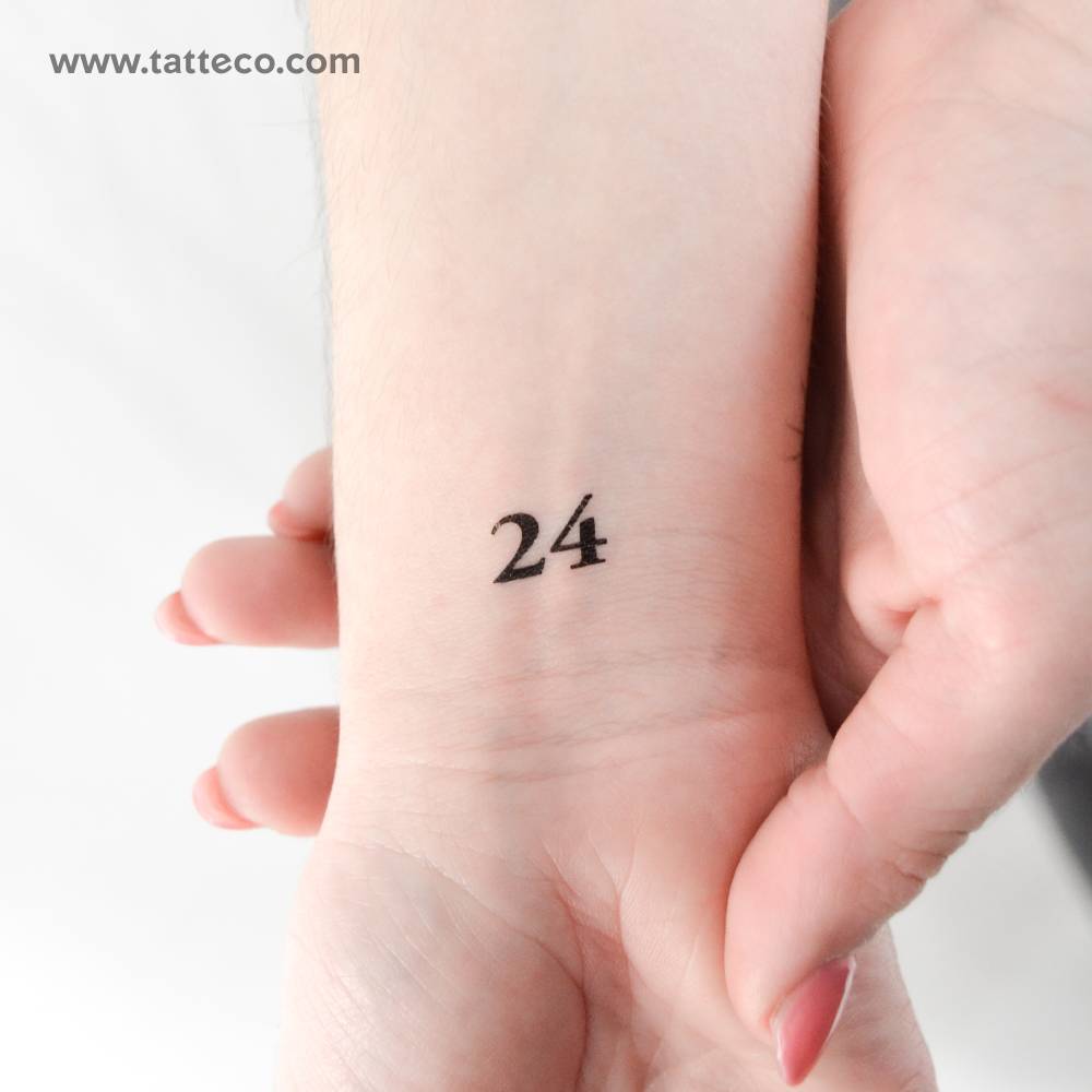 Number "24" temporary tattoo located on the wrist.