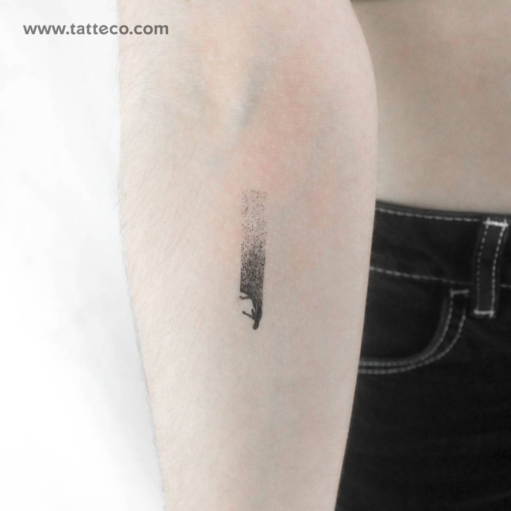 Fall temporary tattoo located on the inner forearm.