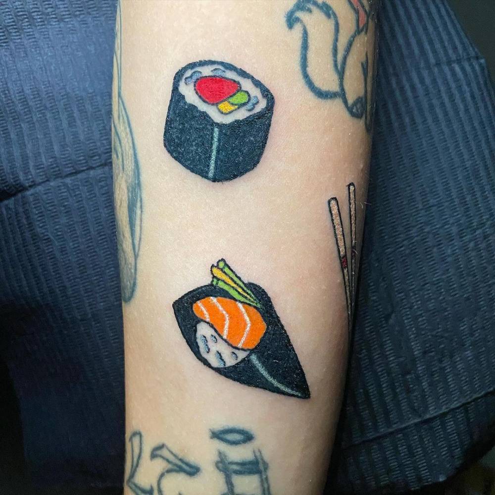 Sushi tattoo located on the forearm, hand poked style.