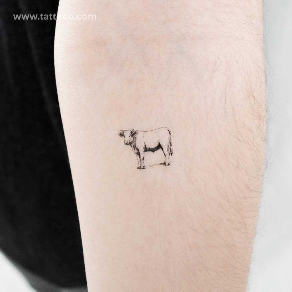Ox temporary tattoo in illustrative style located on the inner forearm.