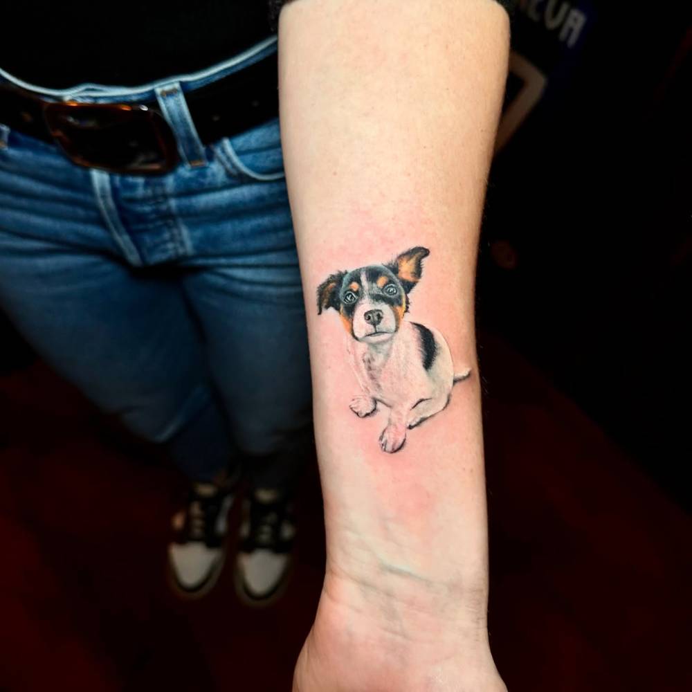 Jack Russell Terrier tattoo in micro-realistic style done on the wrist.