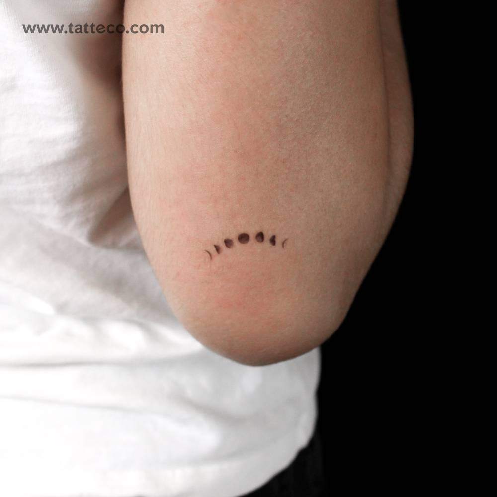 Moon phases semi-permanent tattoo located on the tricep.