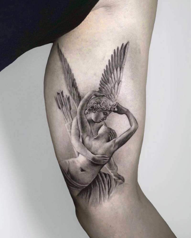 Psyche Revived by Cupid's Kiss tattoo located on the inner arm.