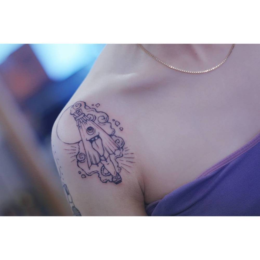 Cartoon style cute umbrella tattoo located on the shoulder.