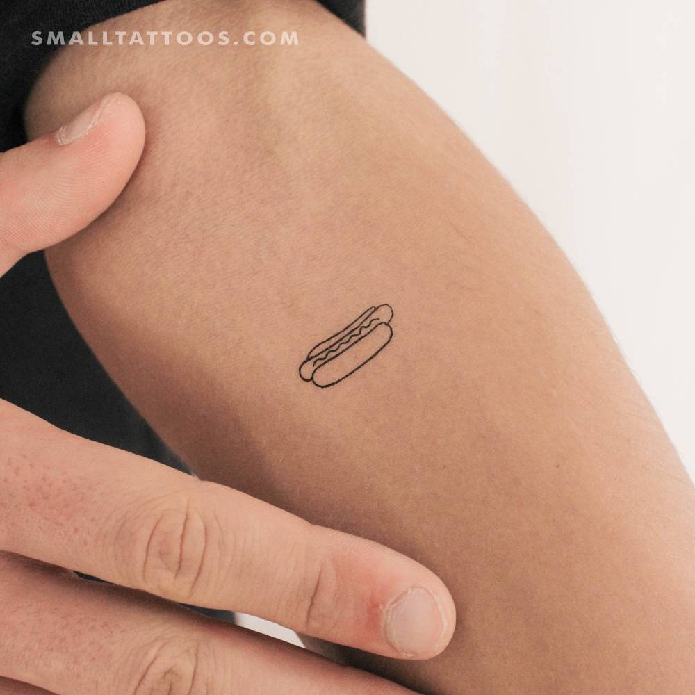 Minimalistic style hot dog temporary tattoo located on the inner forearm.