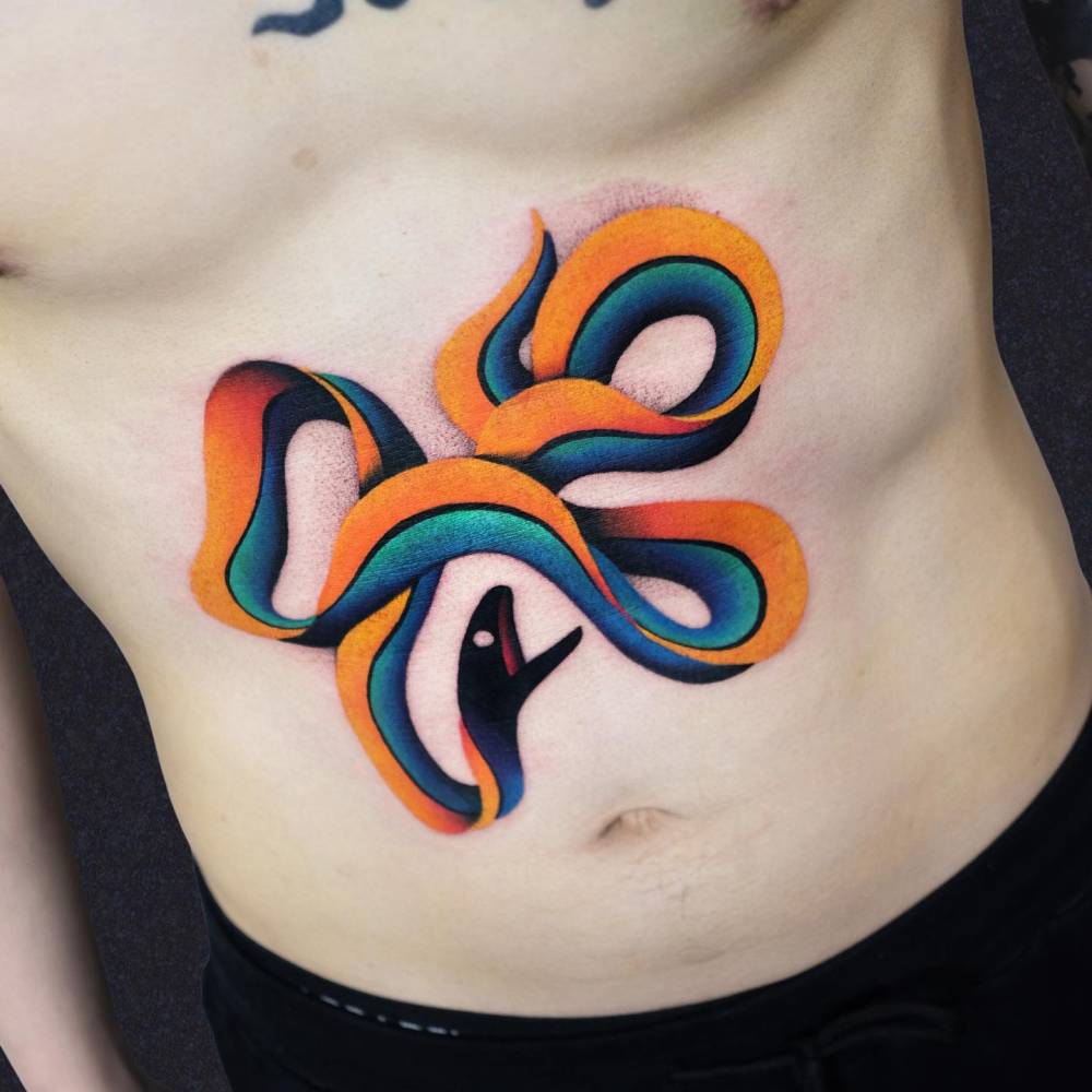 Snake tattoo located on the stomach, contemporary style.