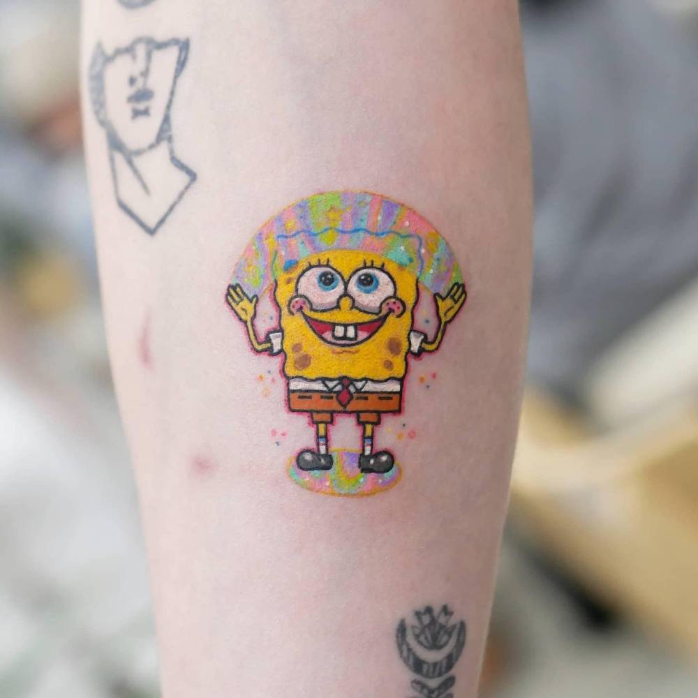 Cartoon style Spongebob tattoo located on the inner forearm.